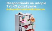 Zdjęcie przedstawia grafikę z napisem &quot;Niespodzianki na urlopie TYLKO pozytywne #stopwłamanomdodomów&quot; oraz stojącą białą szafkę.