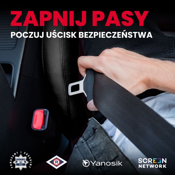 zdjęcie przedstawia rękę zapinającą pas w samochodzie